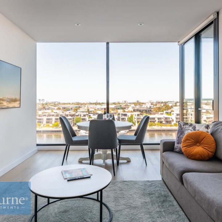 living area with coffee table, sofa,dining area and views