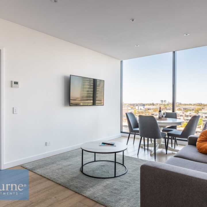 living area with tv, coffee table and sofa